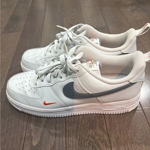 Nike White Low-Top Sneakers with Gray Swoosh & Orange Accents